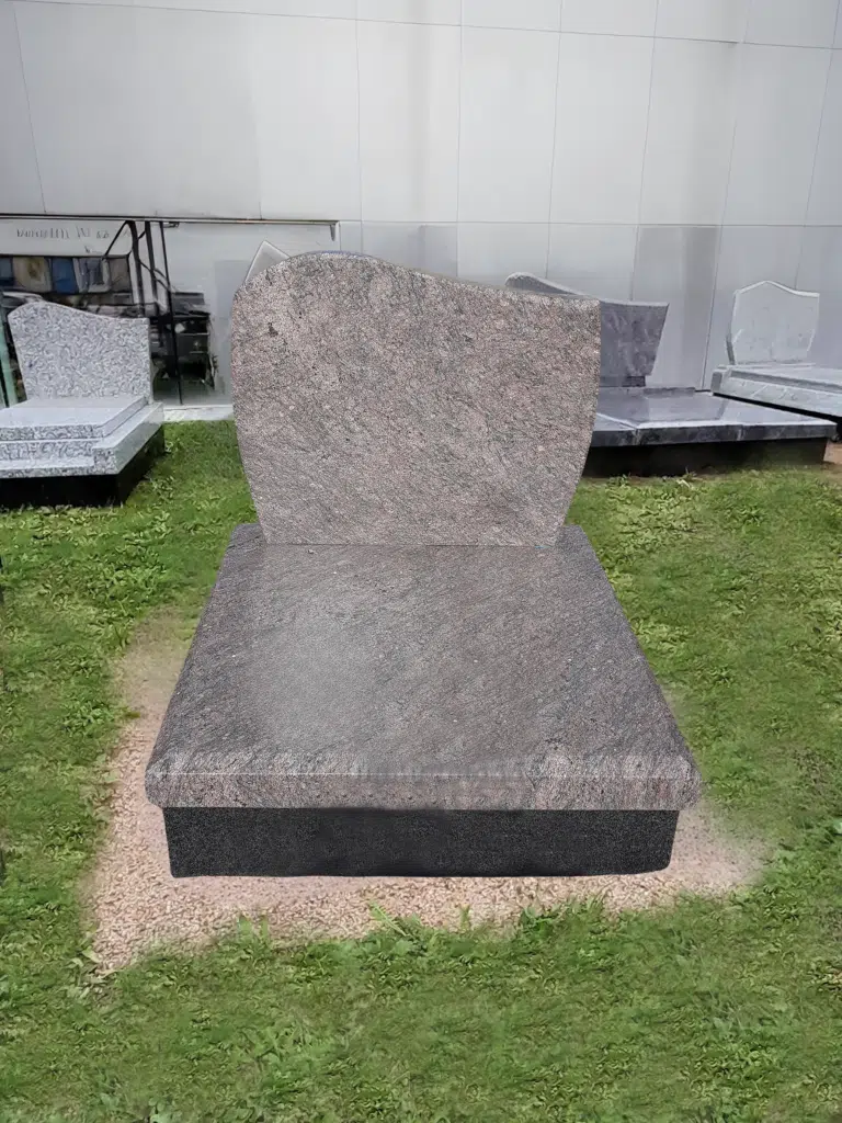 Monument cinéraire épuré en granit gris rose poli avec stèle asymétrique.